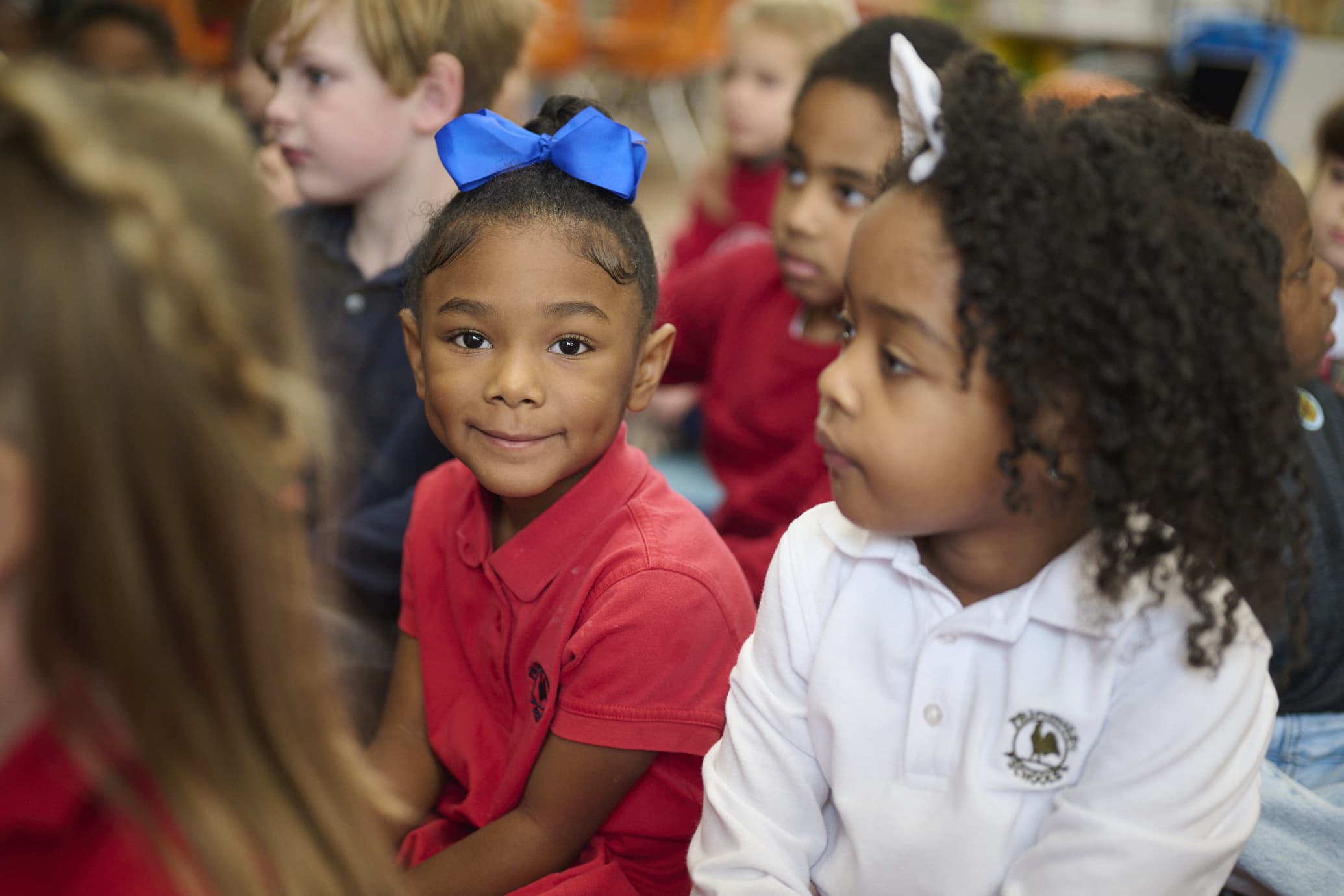 kindergarten child smiling with classmates