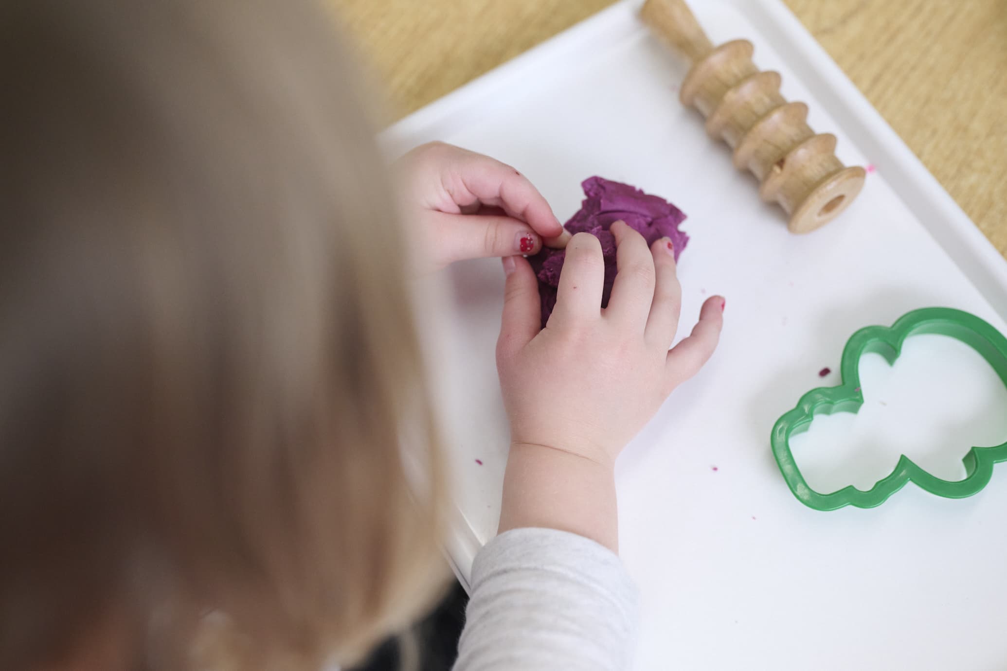 child playing with play dough