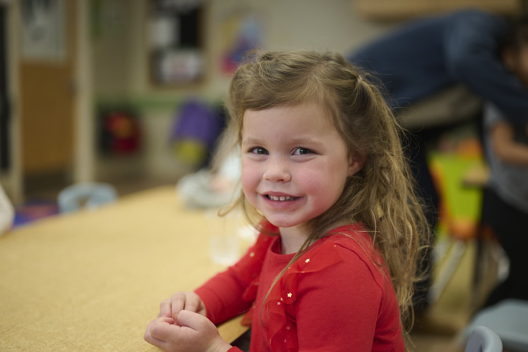 child sitting with backpacks