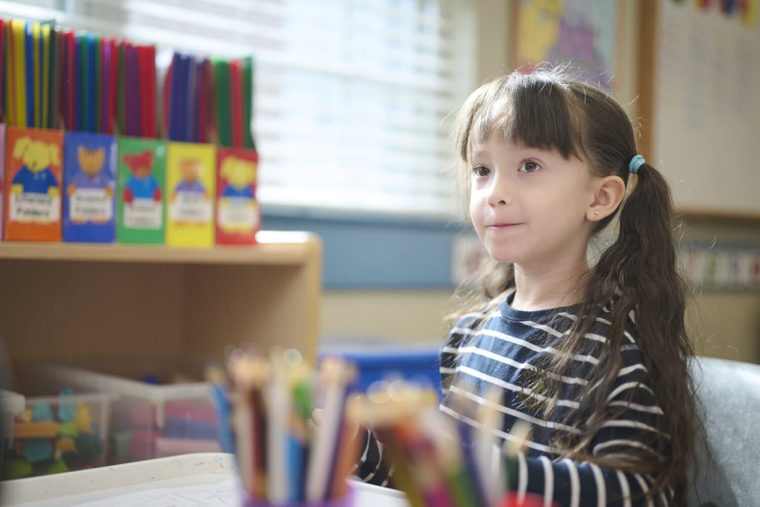 kindergarten child at an activity station