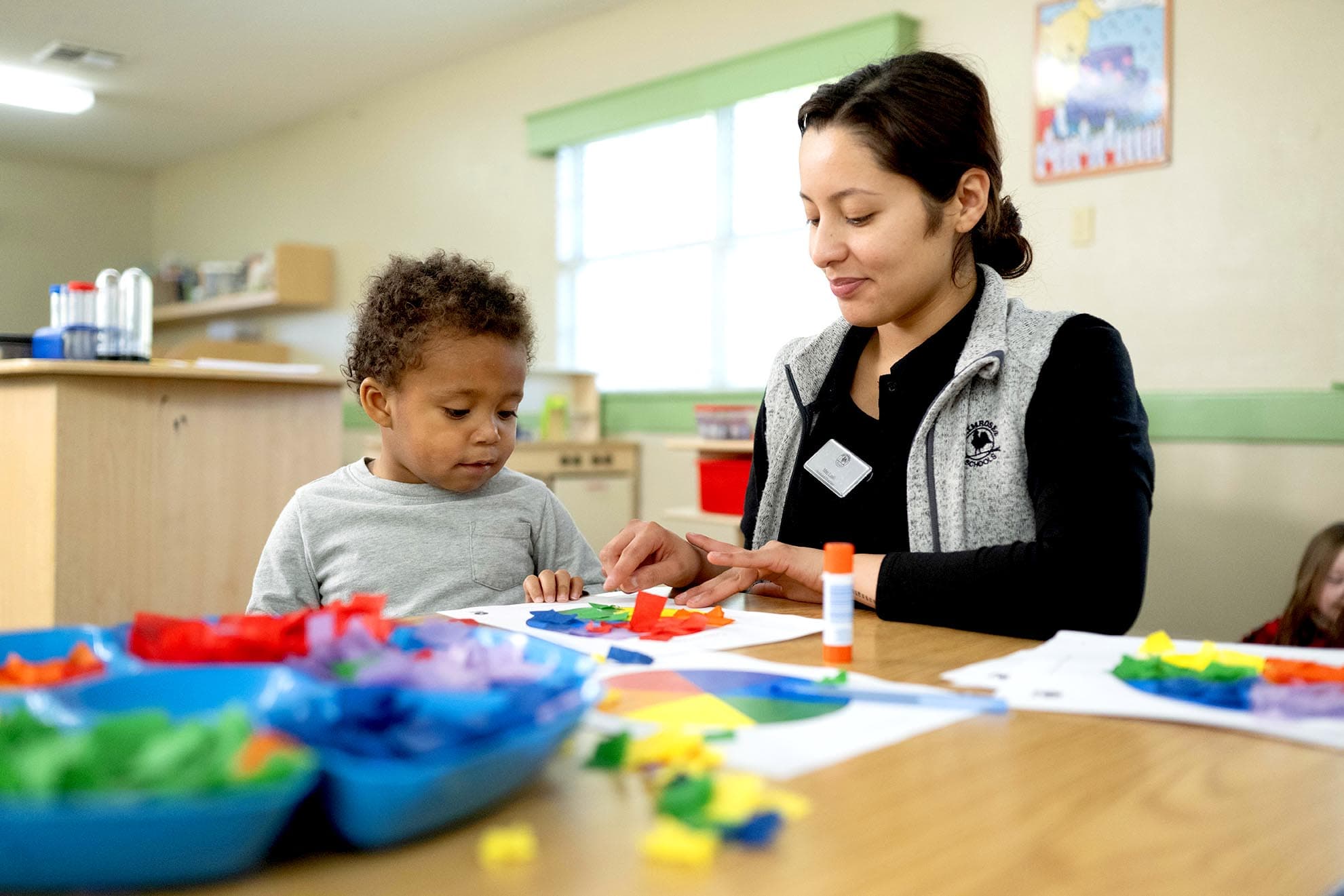 Early preschool class doing a craft