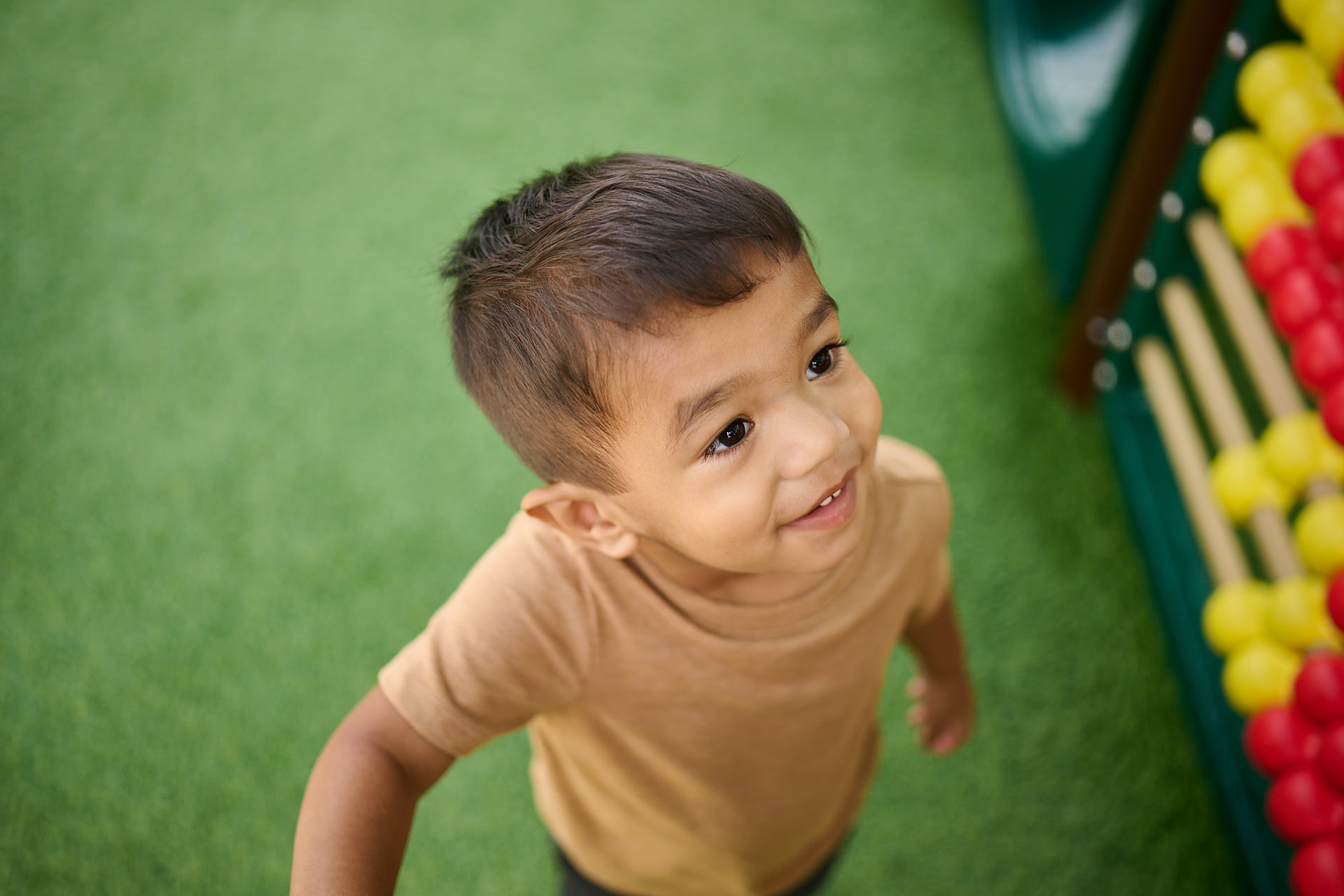 preschooler playing on jungle gym