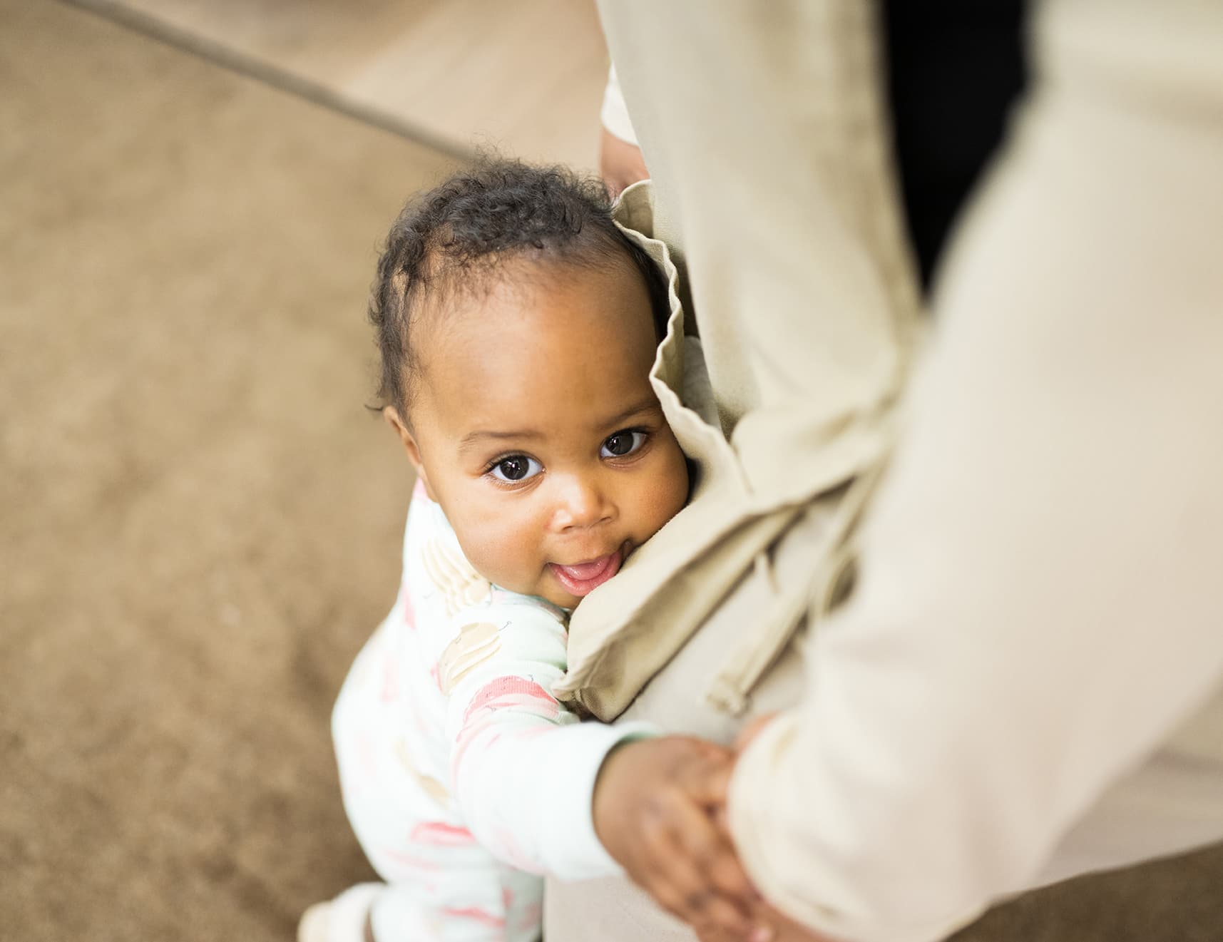 infant hugging teacher