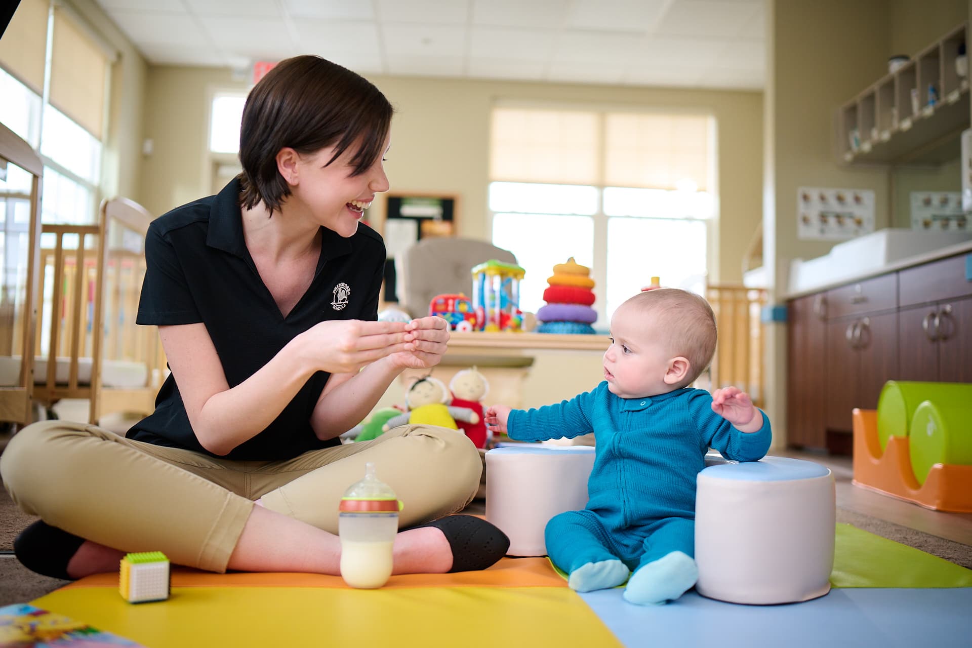 teacher teaching baby more