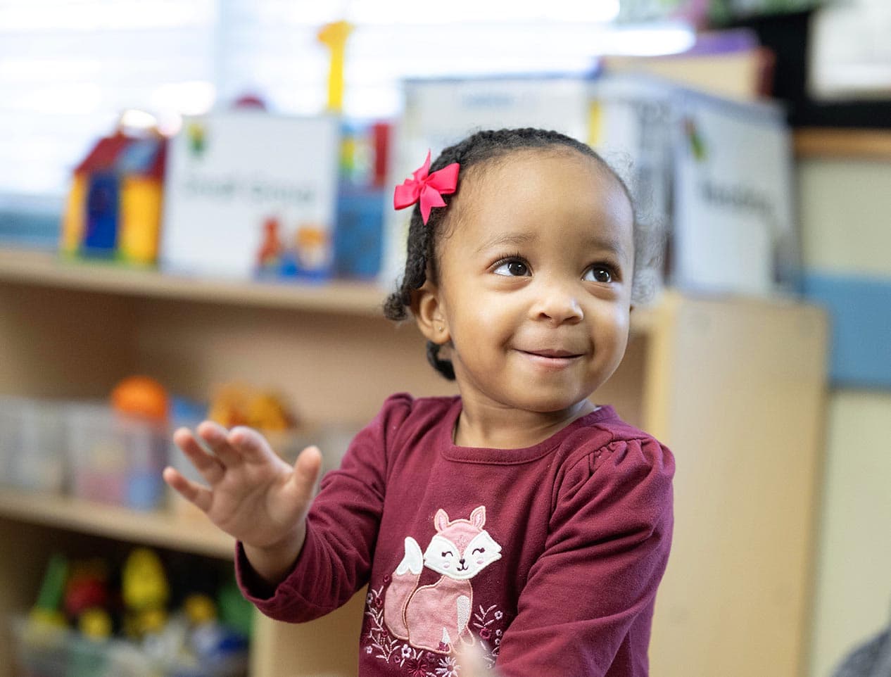 little girl playing in toddler daycare room