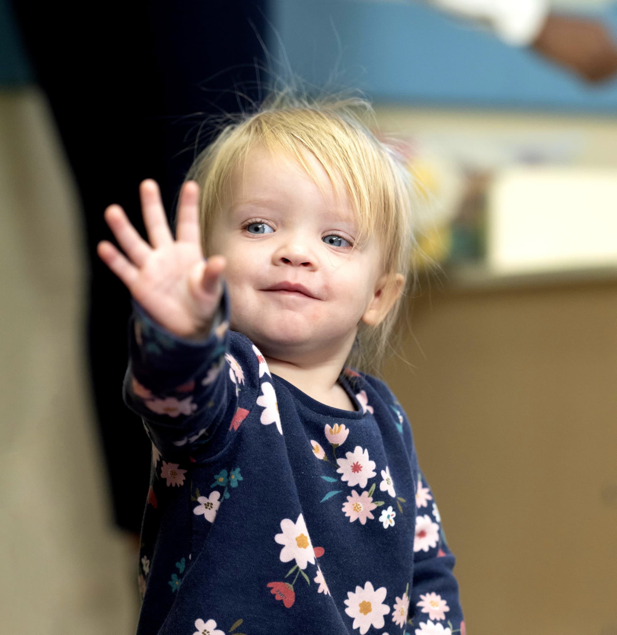 toddler waving