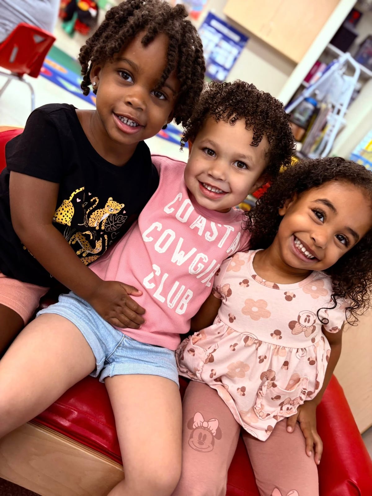preschool kids sitting together on a couch and having fun at primrose school at eagle ranch, best private preschool near me, fort worth, saginaw, texas