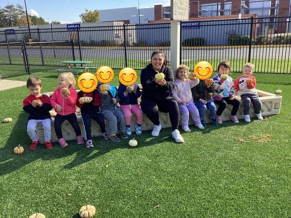 Our Preschool students collecting pumpkins at the Primrose Patch!