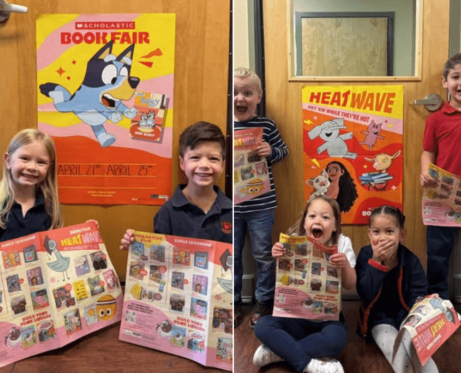 Children posing in front of book fair posters 