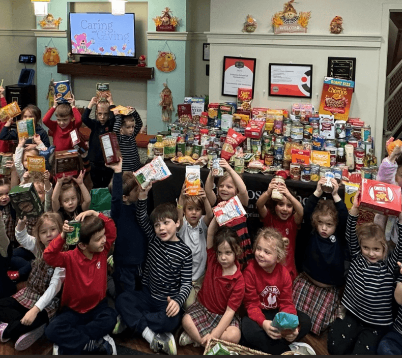 children holding up food donation items 