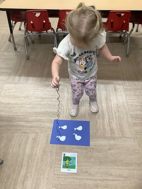 A young child enjoys creative art exploration.