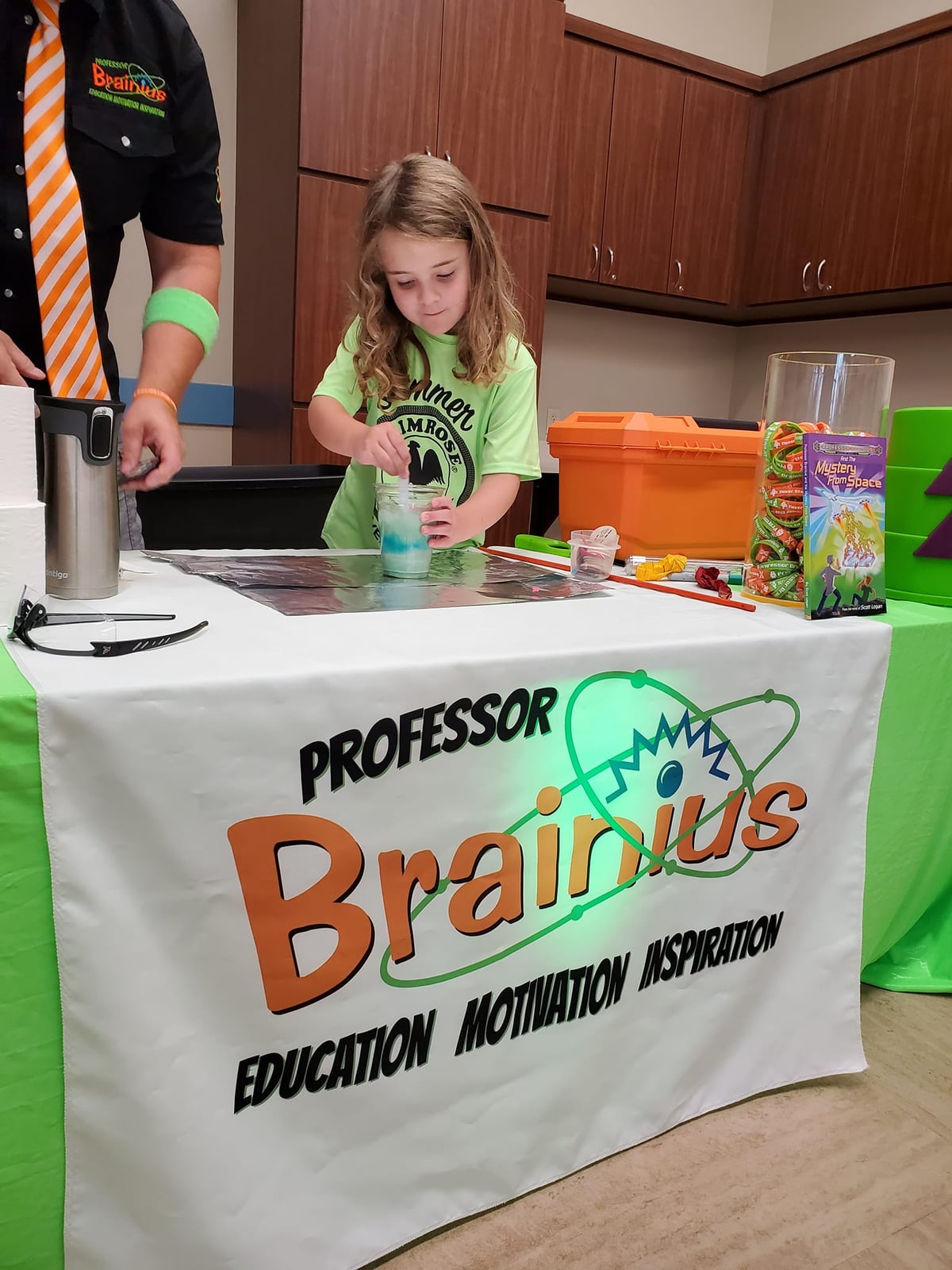 "Young student at Primrose School at Heritage participating in a hands-on science experiment with Professor Brainius during a fun and educational summer camp activity in Fort Worth, TX"