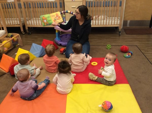 Ms. Megan reading during Og's story time