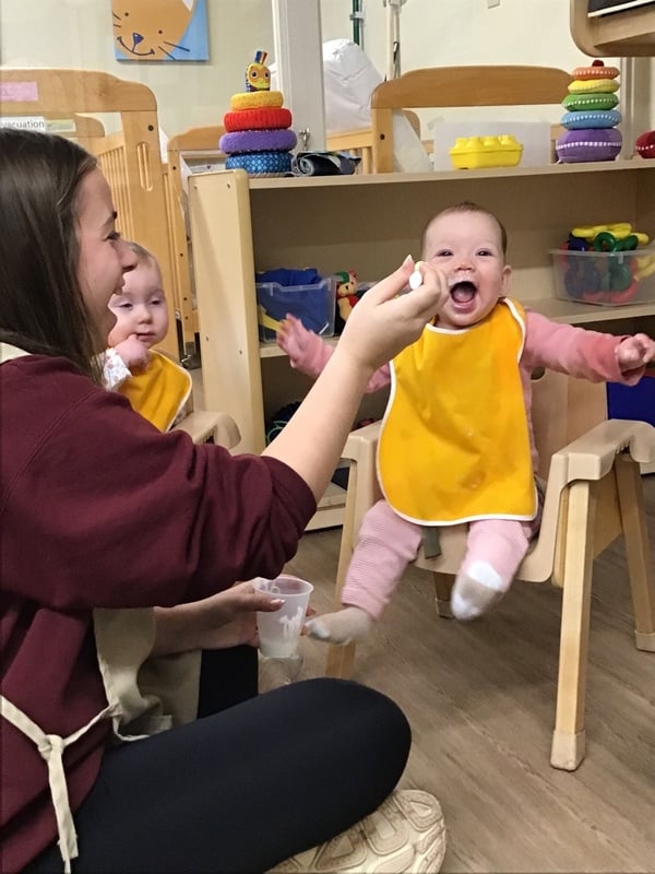 infants enjoying lunch