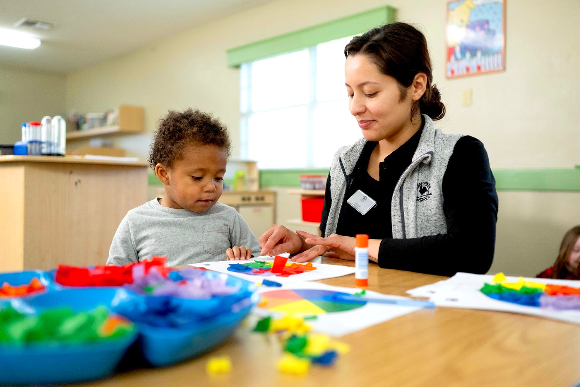 Early preschool class doing a craft