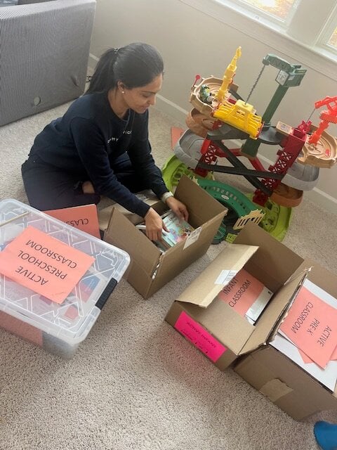 Sneha organizing classroom supplies