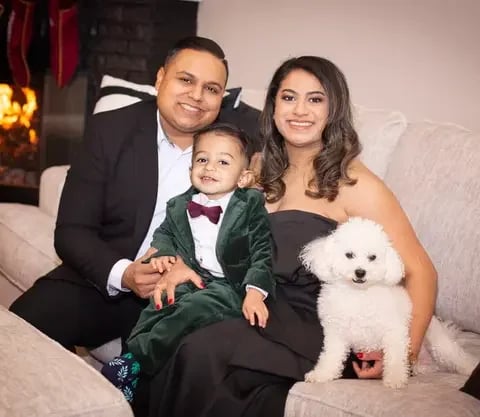 ravi and nikki patel with their child and dog