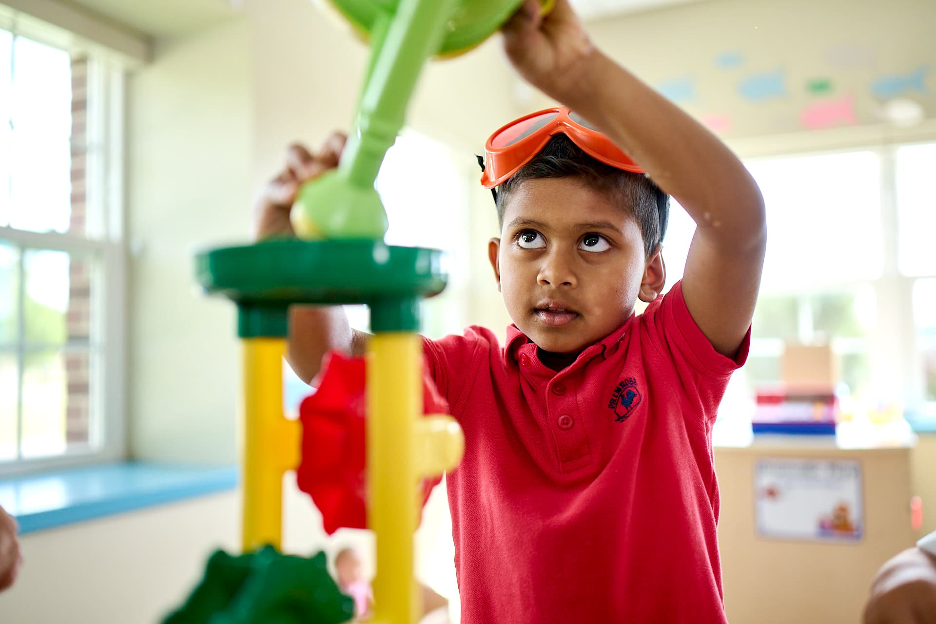 pre-k student doing a stem project