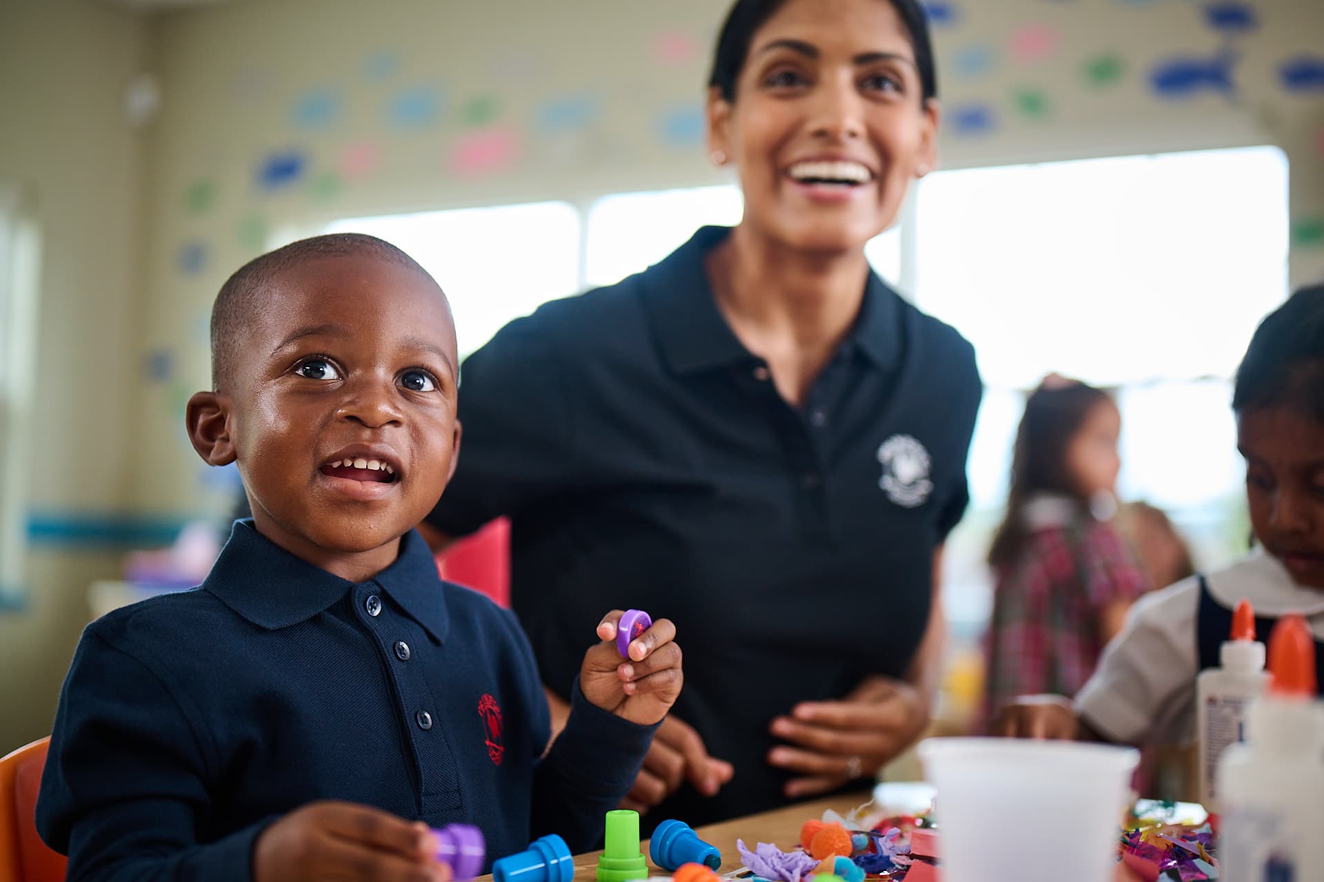 primrose student playing with playdou with teacher