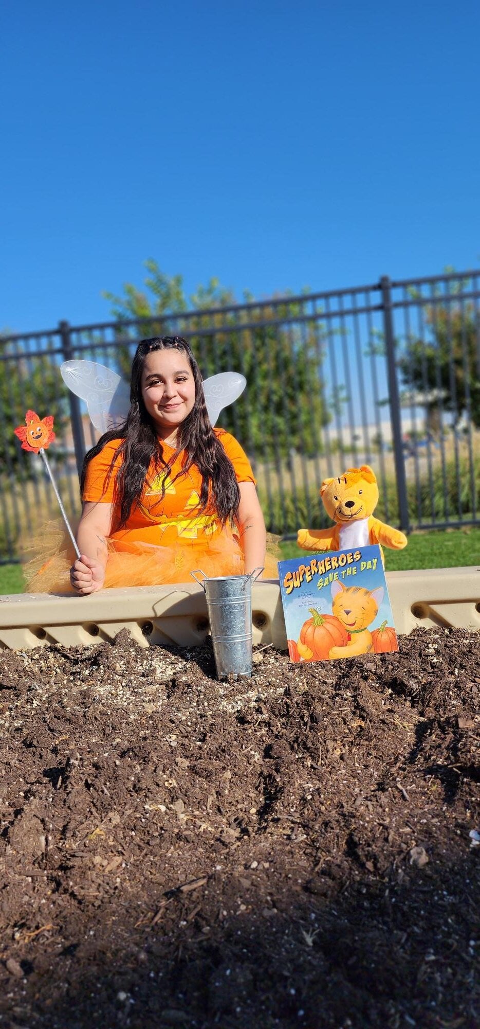 Pumpkin fairy visiting daycare for a fun early learning activity about imagination and magic