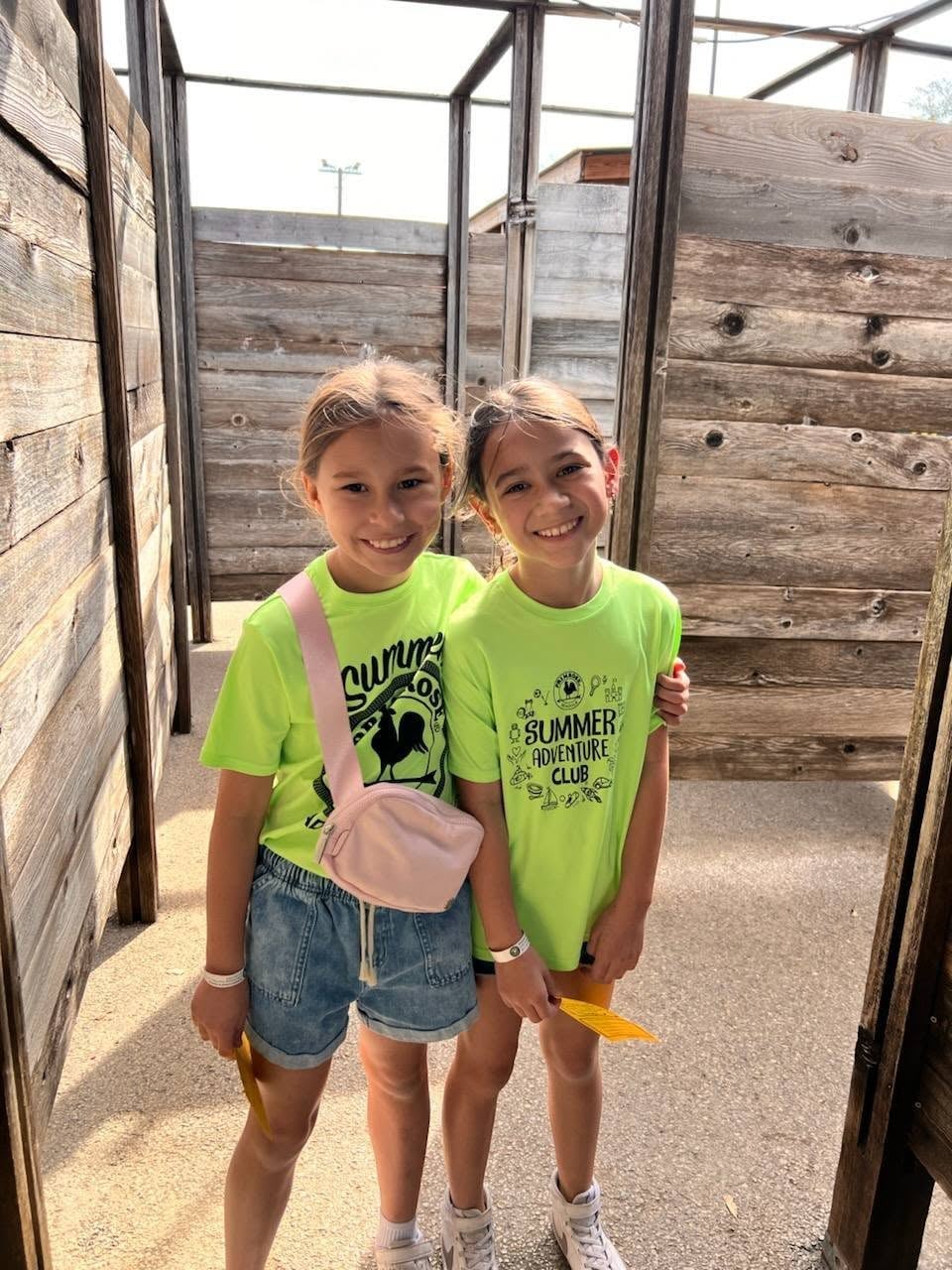 Two children enjoying a field trip during summer camp to the Fort Worth Stockyards