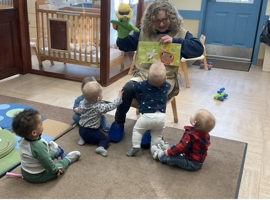 teacher reading to babies