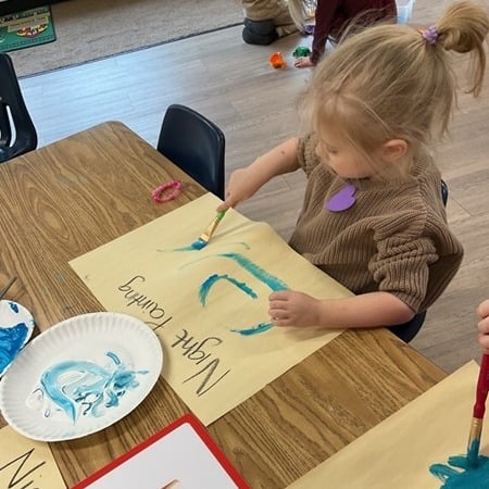 Girl painting a night sky
