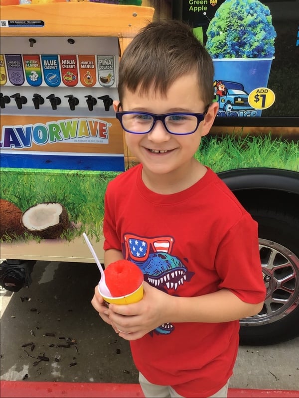 boy eating snow cone