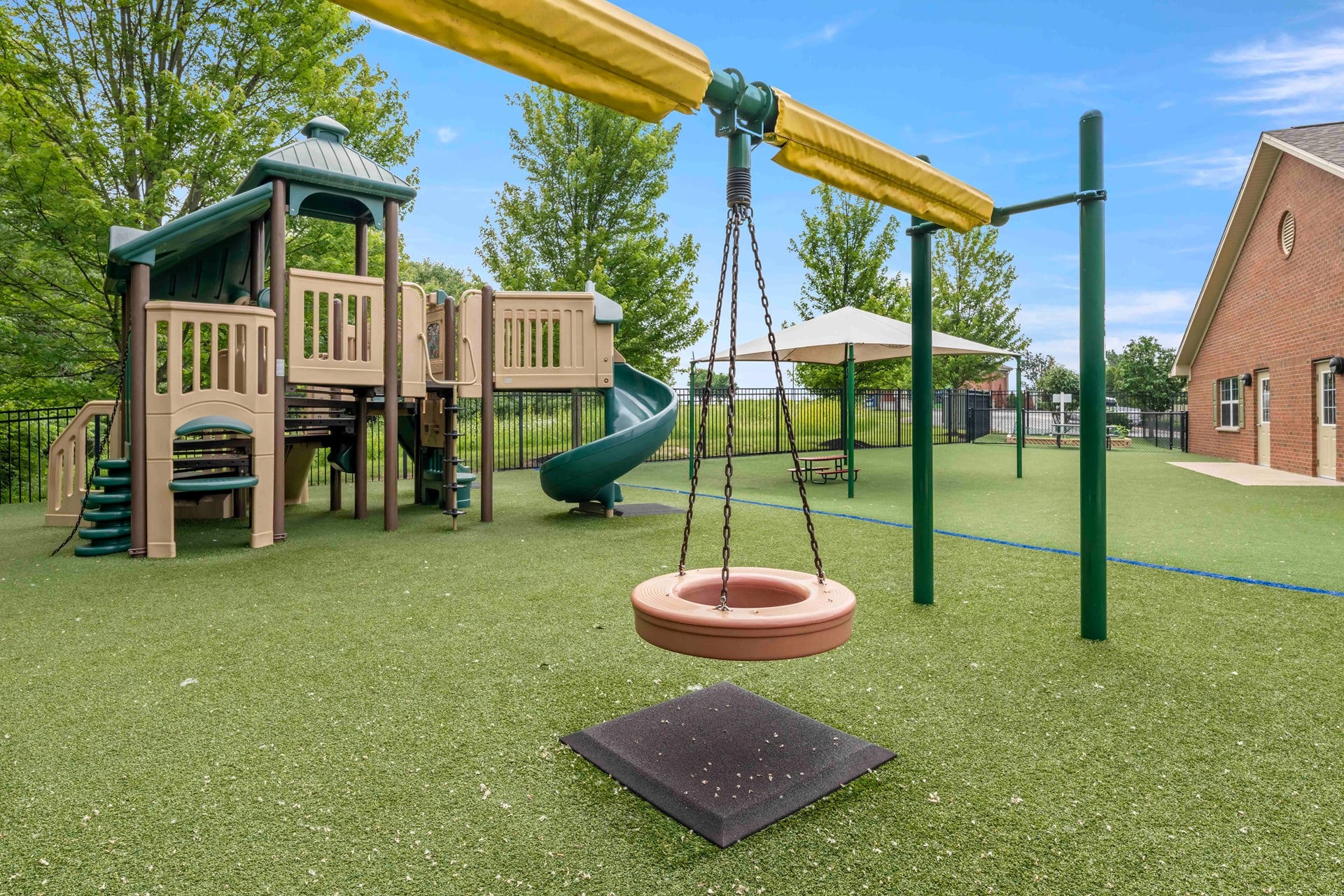 playground at primrose lewis center with tire swing