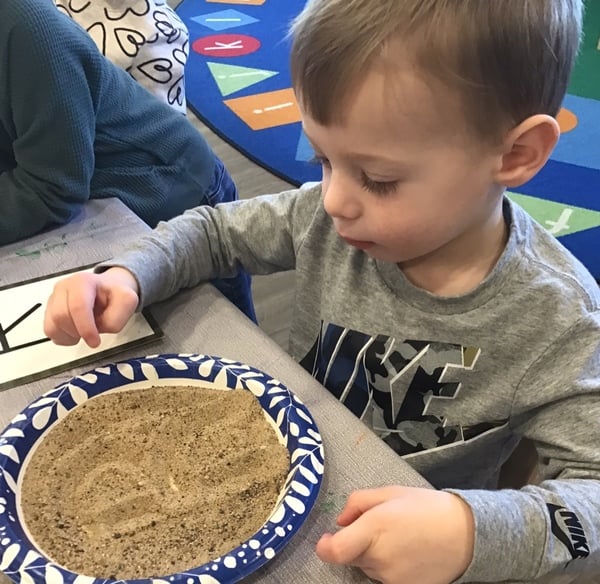 Practicing letters during Children's Choice learning centers