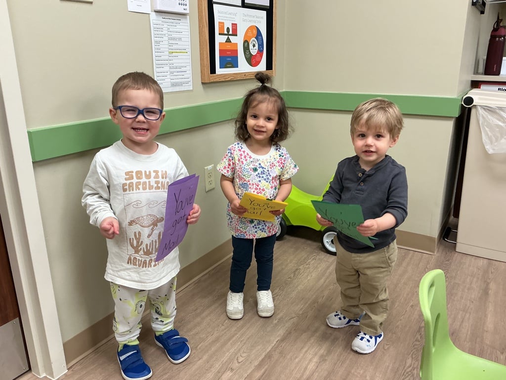 Three Primrose Children Sharing Artwork
