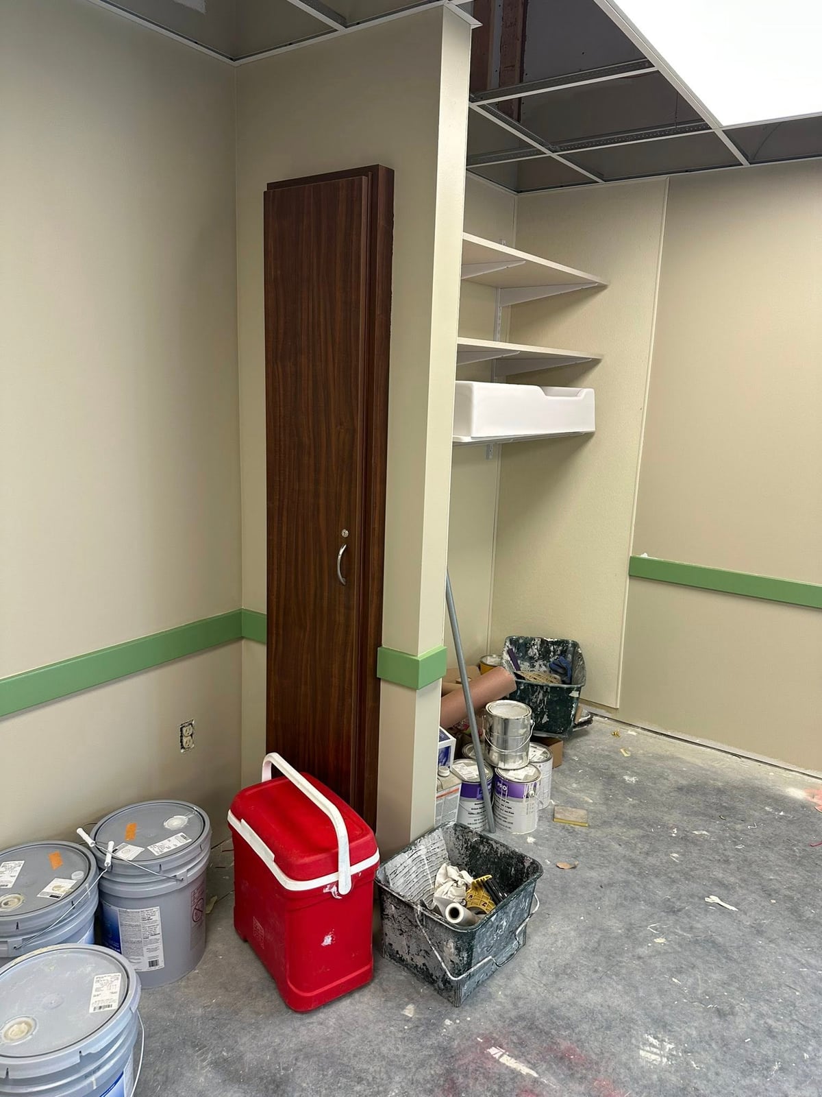 Each classroom is equipped with a broom and dustpan closet.