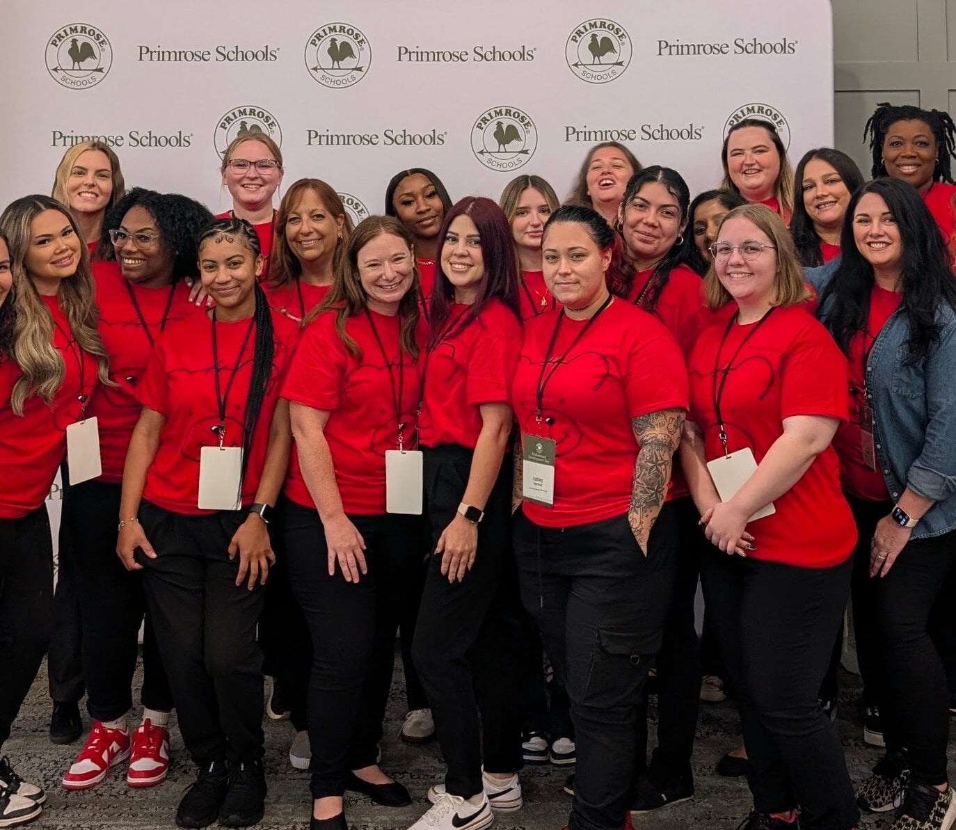 primrose staff at conference in red shirts