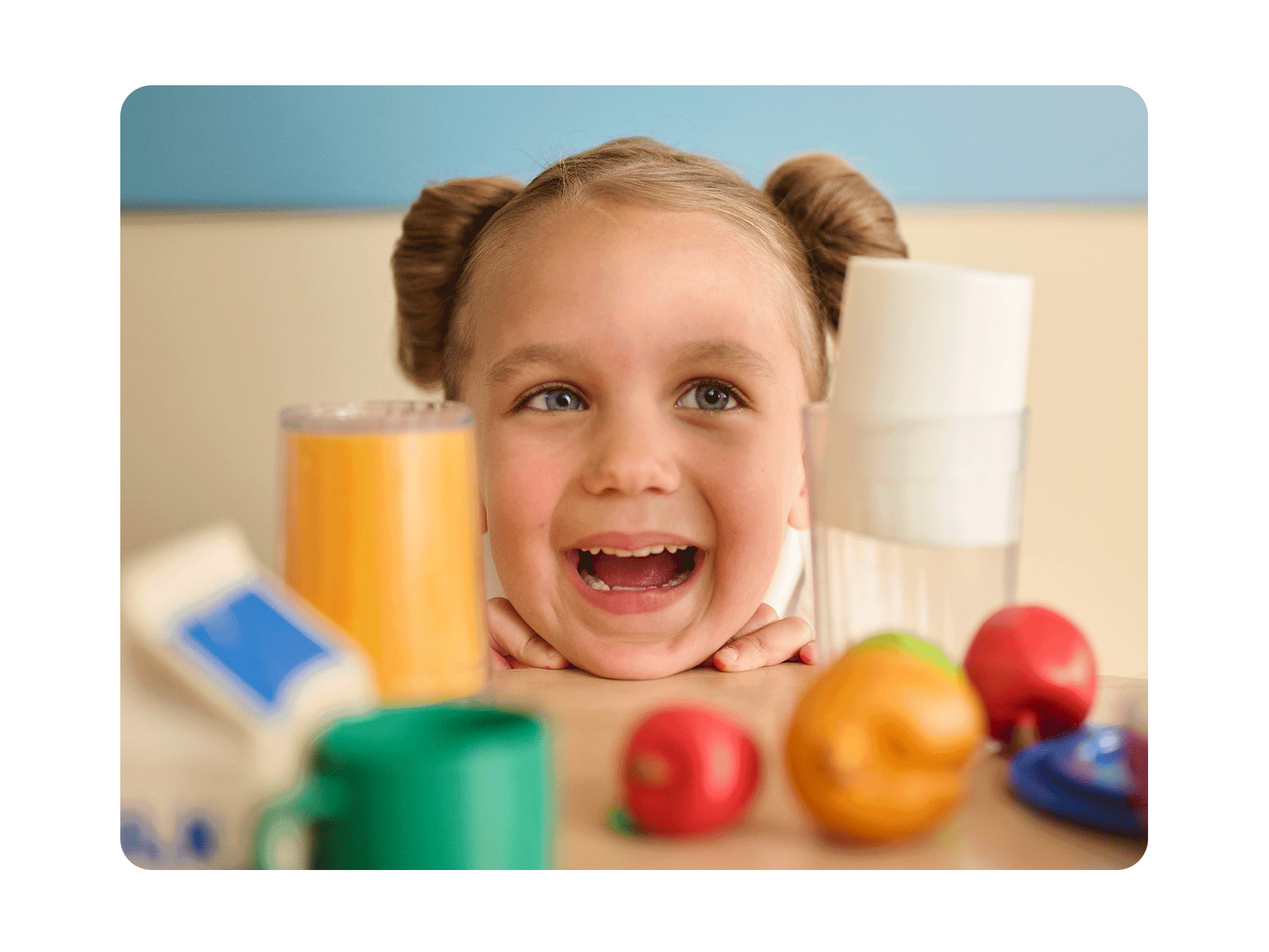 pre-k primrose student playing with food toys